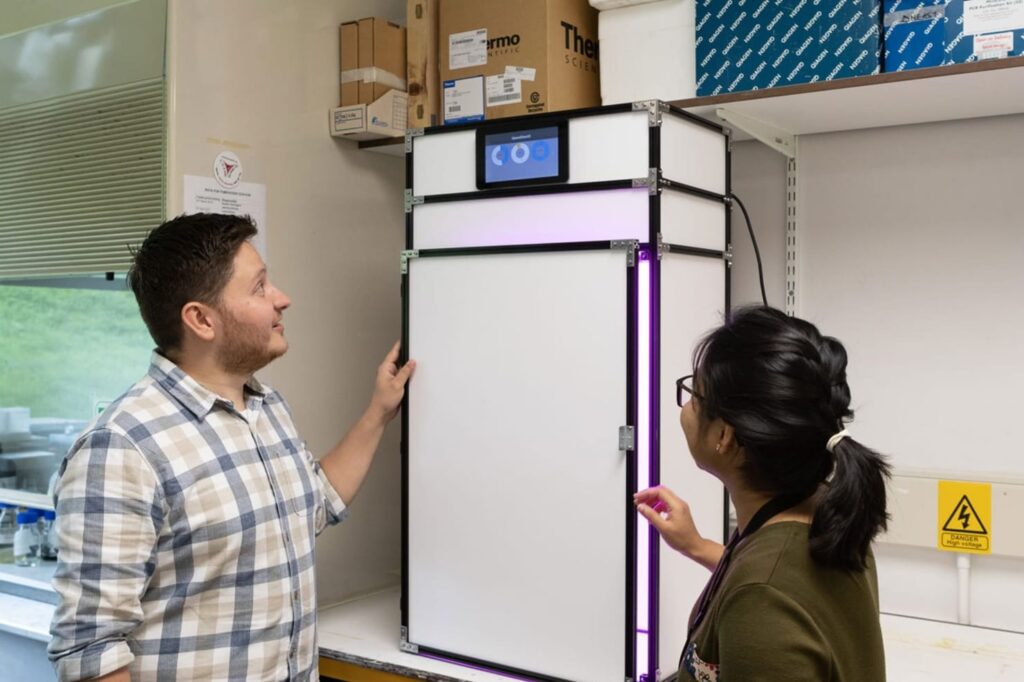 (l-r) Ricardo Ramírez-González and Sreya Ghosh, two GrowCab team members, show the outside of the low-cost, open-source speed breeding cabinet.
